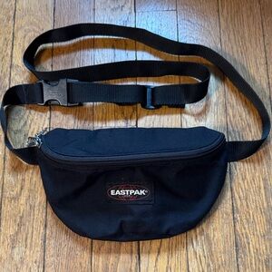 🎒Eastpak black fabric waist pack.